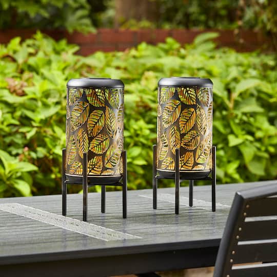 Glitzhome® 14.25" Black Metal Cutout Leaves Pattern Solar Powered LED Outdoor Lantern, 2ct.